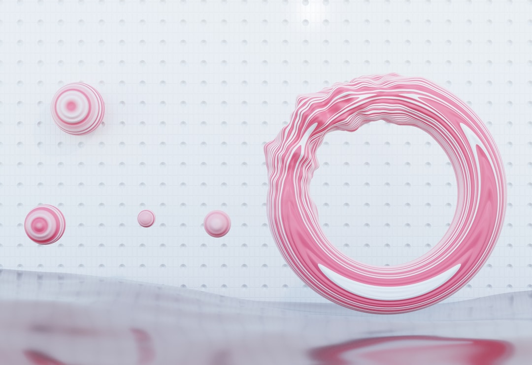 a-white-wall-with-a-pink-circle-on-it-9yumtjammri